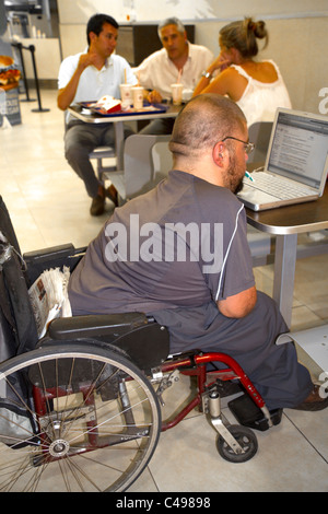 Quadriplegic Argentine man using a computer by typing with his mouth in Buenos Aires, Argentina. Stock Photo