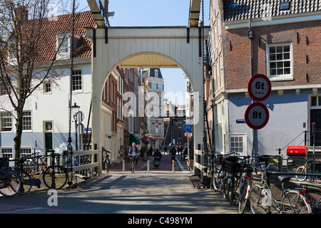 Bridge over the Groenburgwal canal at the end of Staalstraat in the city centre, Amsterdam, Netherlands Stock Photo