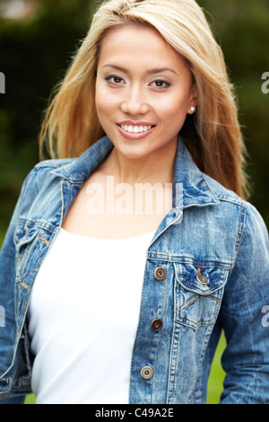 Asian student girl pose in library showing thumb up sign Stock Photo ...