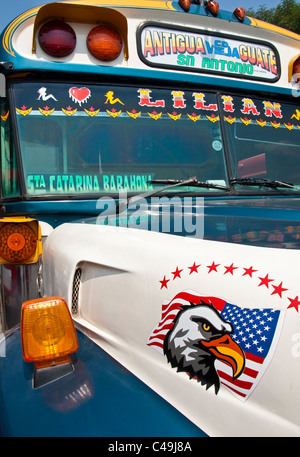 Brightly painted Guatemalan "chicken bus," conversion from retired American school bus, in Antigua Stock Photo