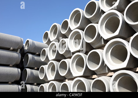 Concrete water pipes stacked in rows Stock Photo