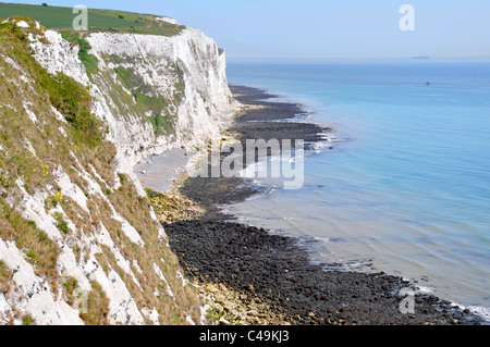 White chalk cliffs of Dover Kent England UK and the English Channel at low tide