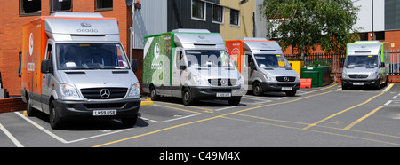 Ocado online home shopping groceries delivery vans parked at London warehouse van depot England UK Stock Photo