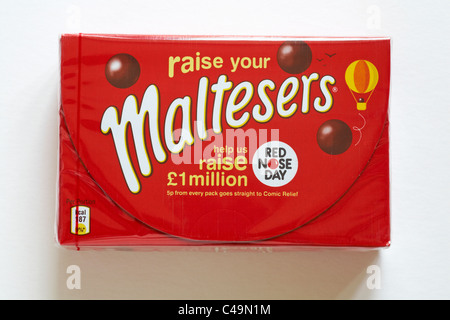 Box of chocolate Maltesers for Red nose day isolated on white background - chocolates with crisp, light honeycombed centres Stock Photo