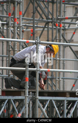 worker on scaffolding in italy Stock Photo