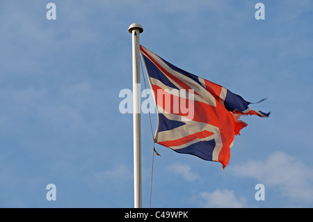 Ripped Union Jack flag, Shingle Street, Suffolk, UK. Stock Photo