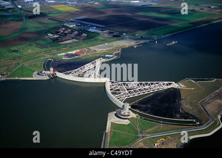 Netherlands, Rotterdam, Closed Storm Surge Barrier called Maeslant Barrier or Maeslantkering. Part of the Delta Works. Aerial. Stock Photo