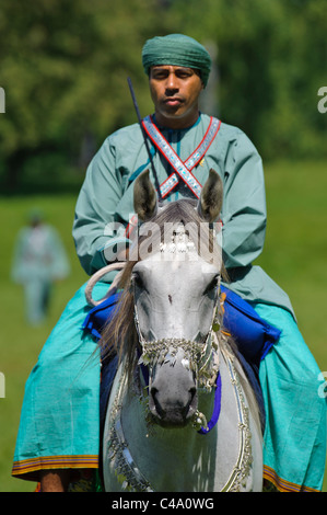 arabian Royal Cavalry of Oman in original costume on arabic horse while ...