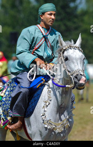 arabian Royal Cavalry of Oman in original costume on arabic horse while ...