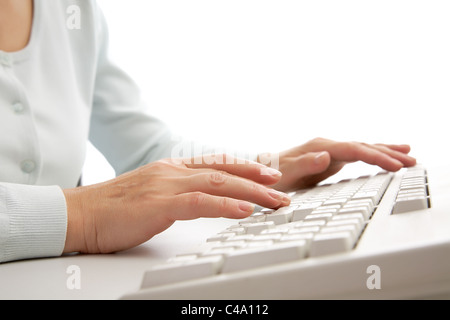 Macro image of female hands typing on keyboard Stock Photo