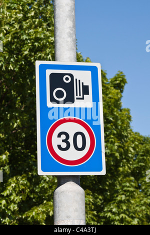 Speed limit 30 miles per hour with speed camera sign Stock Photo
