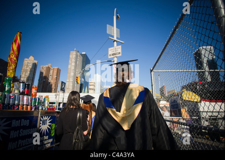 Graduates outside of the Jacob Javits Convention Center in NY after the John Jay College commencement Stock Photo