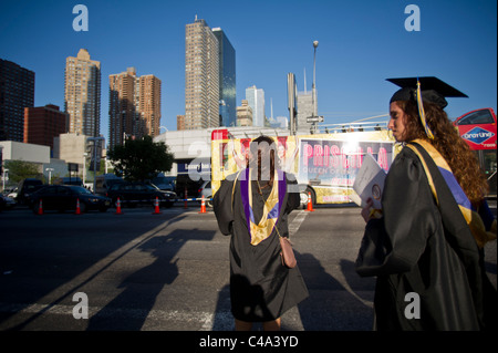 Graduates outside of the Jacob Javits Convention Center in NY after the John Jay College commencement Stock Photo