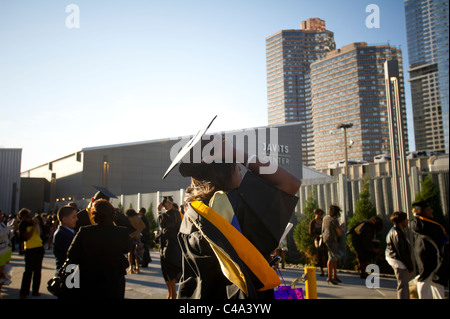 Graduates outside of the Jacob Javits Convention Center in NY after the John Jay College commencement Stock Photo