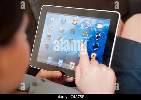 close up of woman using iPad digital tablet computer Stock Photo