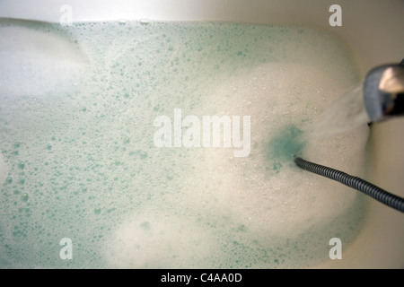 Filling bathtub Stock Photo