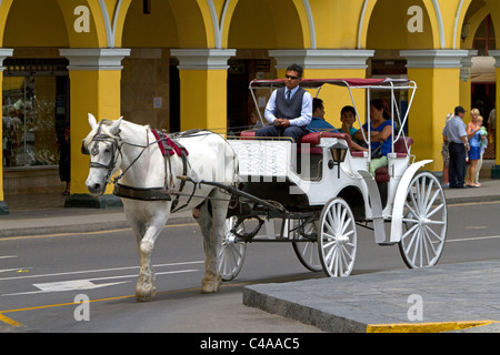 Horse drawn carriage at the Plaza Mayor or Plaza de Armas of Lima, Peru. Stock Photo