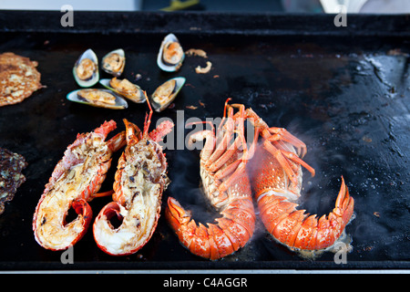 New Zealand lobster on grill in  a small gourmet restaurant in Kaikoura, New Zealand Stock Photo