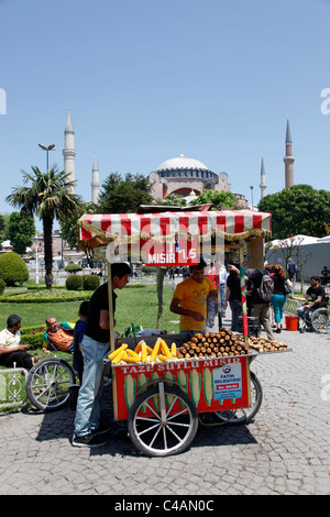 Corn on the Cob street vendor at the Hagia Sophia or Aya Sofya Mosque in Istanbul, Turkey Stock Photo