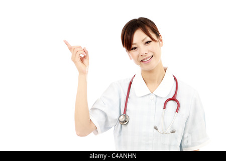 Young asian female nurse pointing Stock Photo