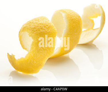 Twist of citrus peel on a white background. Stock Photo