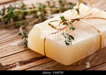 Piece of natural soap with thyme. Stock Photo