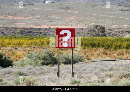 White question mark  on red billboard next to the national road in the Western Cape, South Africa. Stock Photo