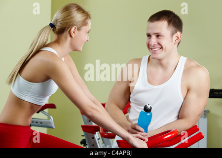 Portrait of sporty couple interacting during break Stock Photo