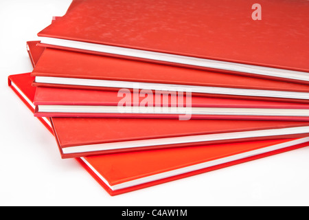 several red books on a white background Stock Photo