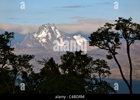 The peaks of Mount Kenya from the Aberdare National Park.  Mount Kenya is Africas second highest mountain rising to a height of Stock Photo