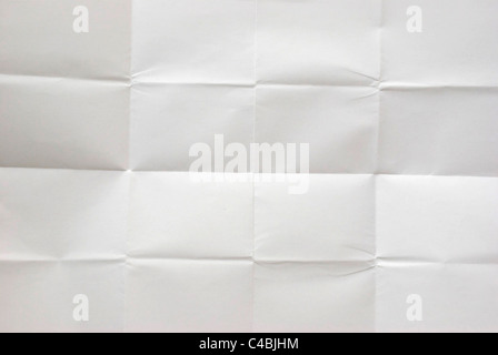 white sheet of paper folded into 16 pieces Stock Photo