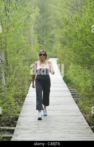 Lady exercising outdoors Stock Photo