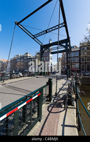 Bridge over the Kloveniersburgwal canal at the end of Staalstraat in the city centre, Amsterdam, Netherlands Stock Photo