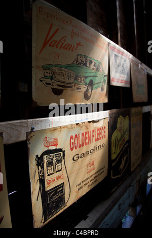 Old Australian advertising signs for sale in a junk shop in Maldon. Stock Photo