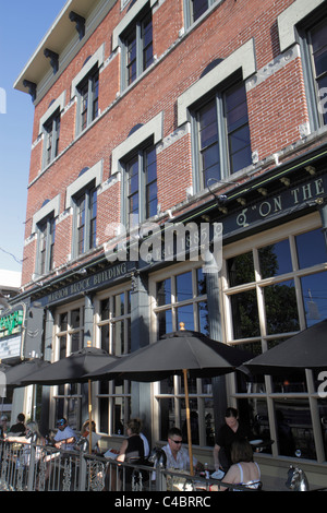 Florida,Marion County,Ocala,Downtown Square,building,brick,al fresco sidewalk outside tables,al fresco,dining,umbrellas,restaurant restaurants food di Stock Photo