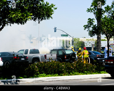 Firefighters working on an SUV fire in Oxnard California Stock Photo