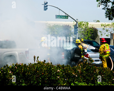 Firefighters working on an SUV fire in Oxnard California Stock Photo