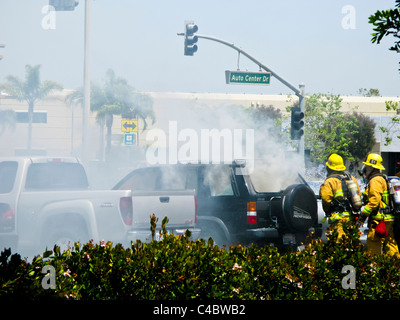 Firefighters working on an SUV fire in Oxnard California Stock Photo