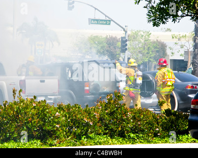 Firefighters working on an SUV fire in Oxnard California Stock Photo