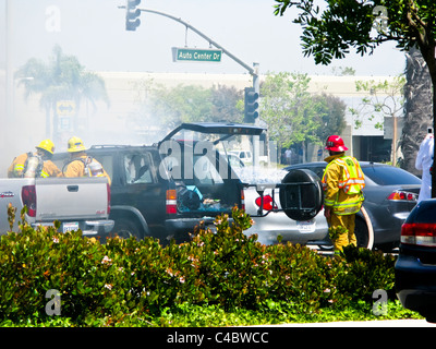 Firefighters working on an SUV fire in Oxnard California Stock Photo