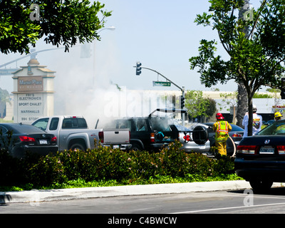 Firefighters working on an SUV fire in Oxnard California Stock Photo