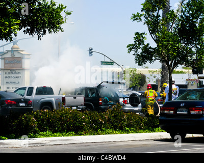 Firefighters working on an SUV fire in Oxnard California Stock Photo