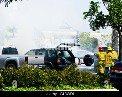 Firefighters working on an SUV fire in Oxnard California Stock Photo