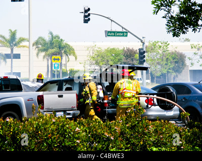 Firefighters working on an SUV fire in Oxnard California Stock Photo