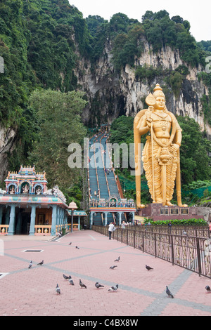 Golden statue of Lord Murugan at the entrance to Batu Caves. Kuala Lumpur – Malaysia. Stock Photo