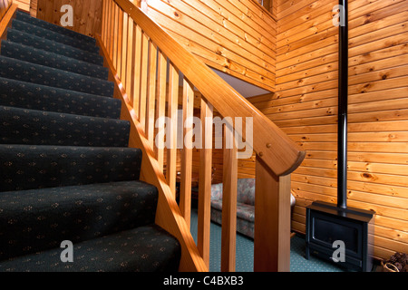 Detail of stairway and nice warm interior of mountain lodge apartment. Stock Photo
