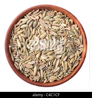 fennel seeds in a wooden bowl isolated on white Stock Photo