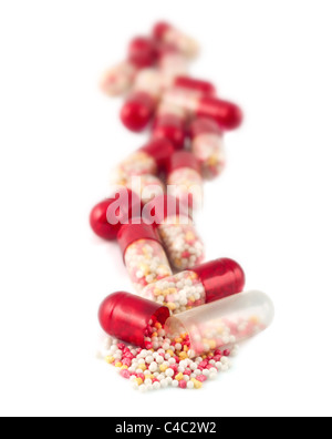 Red pills isolated on white Stock Photo