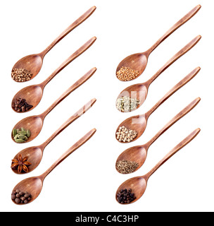 Wooden spoon full of different spices isolated on white background Stock Photo