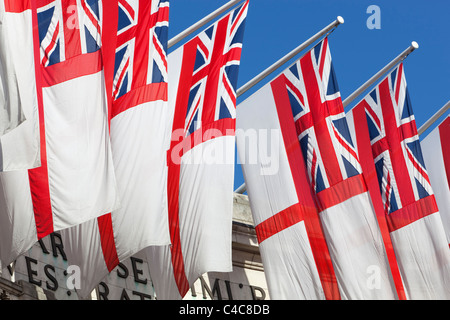 Royal Navy White Ensigns flying above Admiralty Arch along The Mall in London Stock Photo